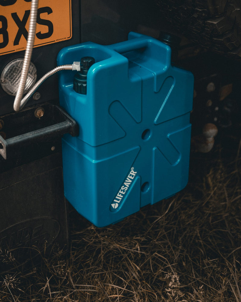 Load image into Gallery viewer, Blue LifeSaver Jerrycan fixed to the back of a landrover

