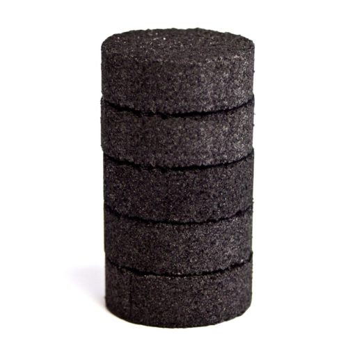 Stack of activated carbon filters on a white background